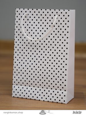 ساک دستی طرح خال خالی سفید Hand bag with white polka dot design